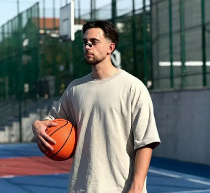 Basketball player wearing the respiro nose strip while holding a basketball ball